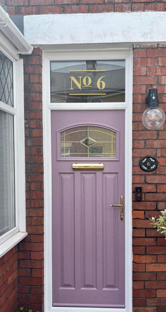 Lilac composite front door with arched leaded glass and transom