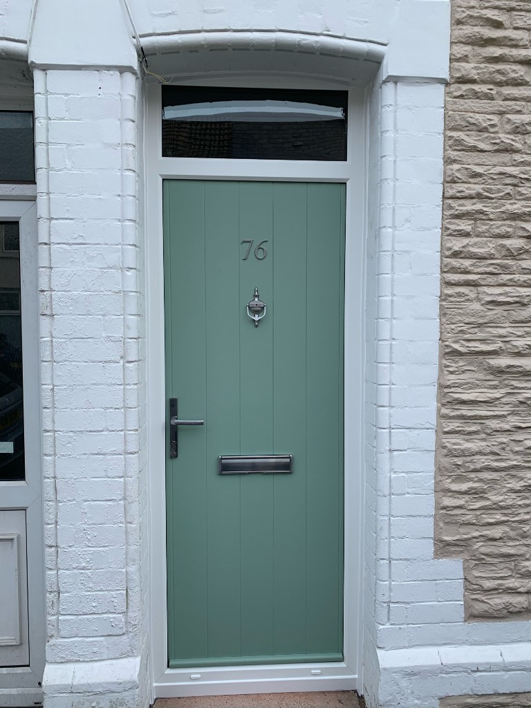 Pebbledash house with uPVC door and windows