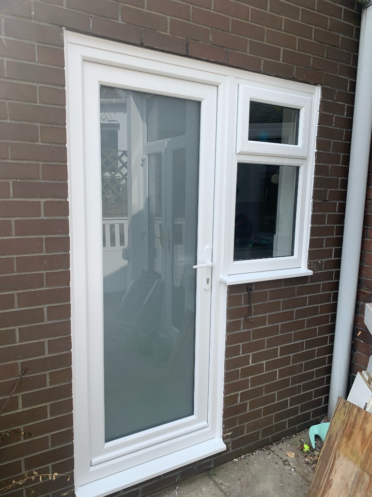 Dark grey composite door with leaded glass