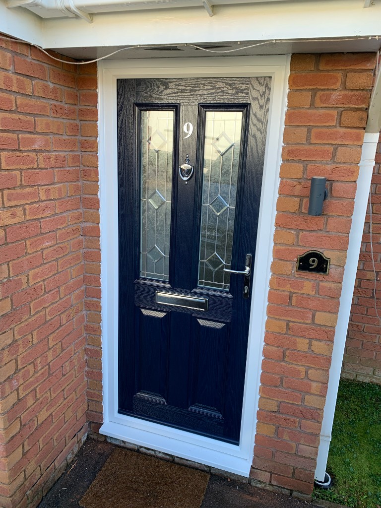 White bi-fold doors on brick