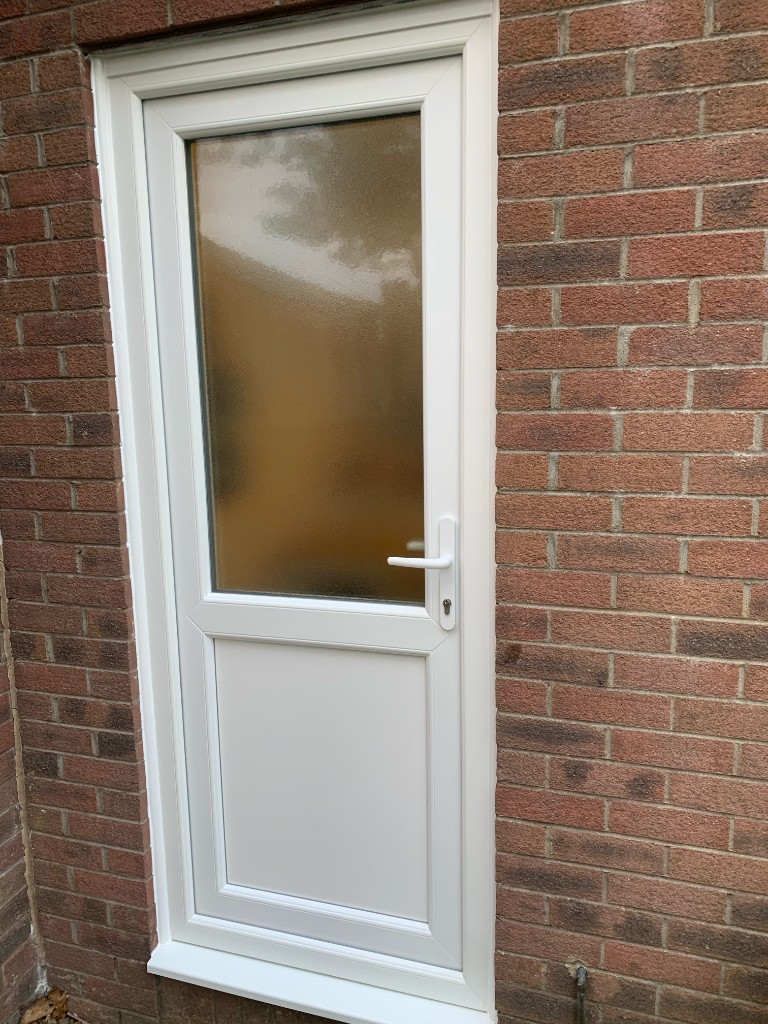 Rear of house with roof lanterns and bifolds