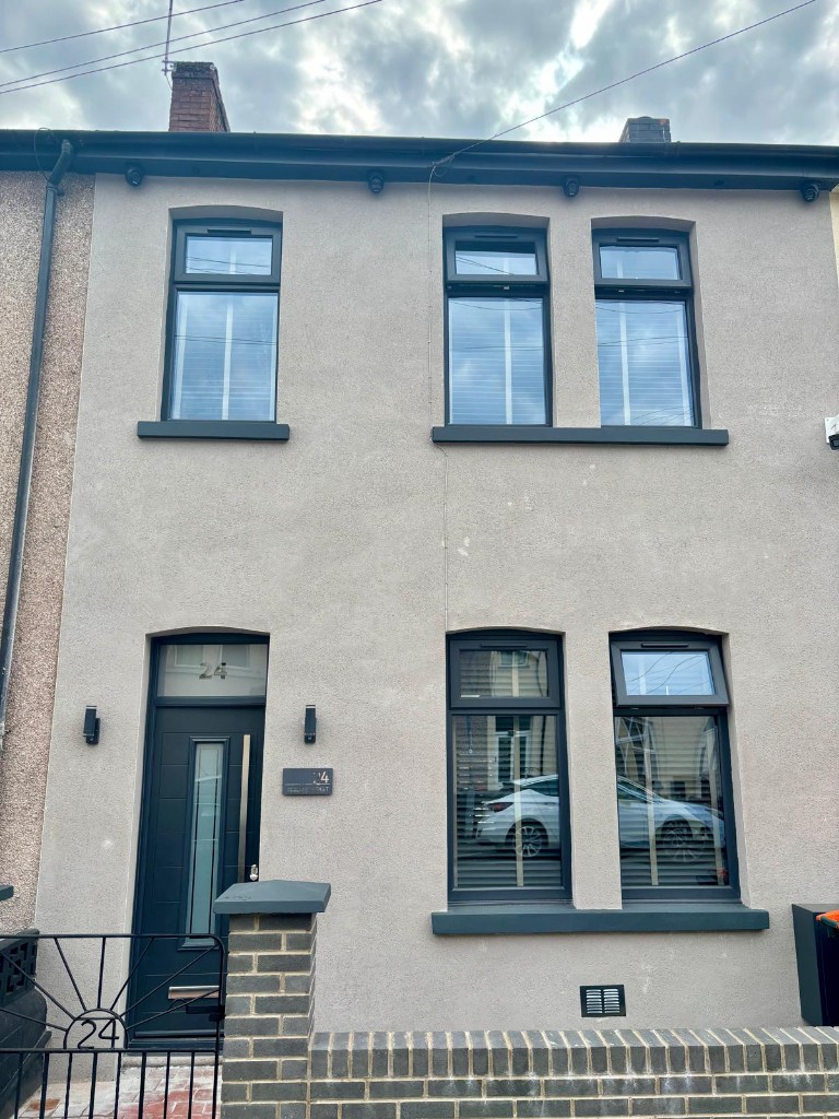 Terraced house with dark grey uPVC windows
