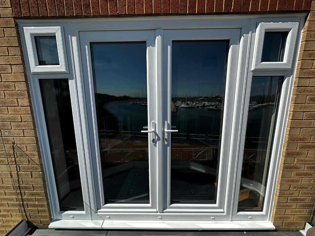 White uPVC French doors with side windows